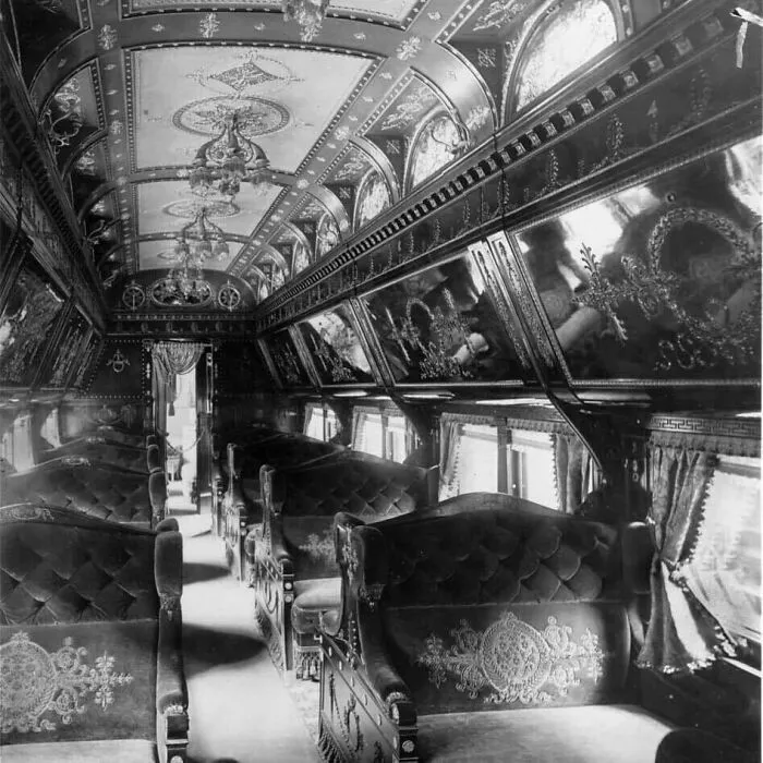 Ornate vintage train car interior in black and white