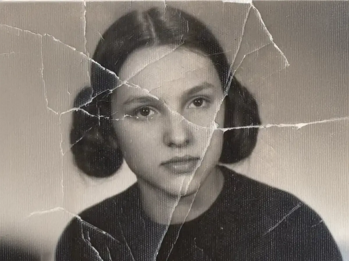Severely cracked vintage portrait before restoration